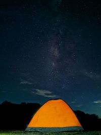 Low angle view of tent against sky at night