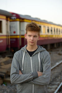 Portrait of boy standing on train