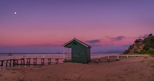 Scenic view of beach against sky during sunset