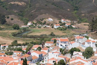 High angle view of houses by mountain