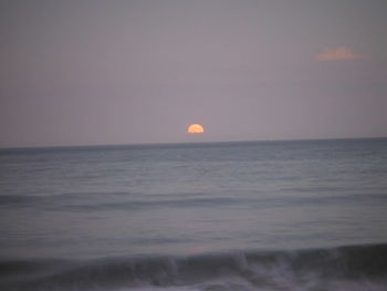 Scenic view of sea against sky at sunset