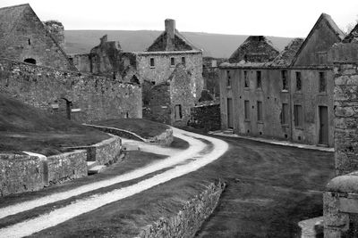 Historic fort by pathway against sky