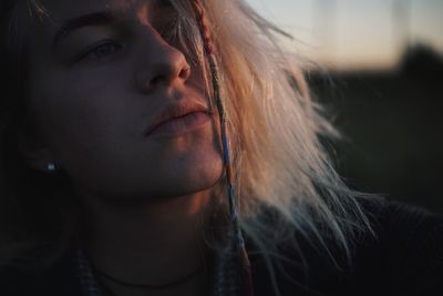 Close-up of thoughtful young woman looking away