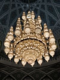 Low angle view of illuminated chandelier in building