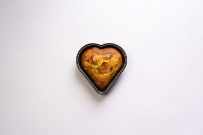Directly above shot of heart shape on white background