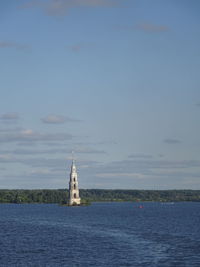 Sailboat in sea against sky