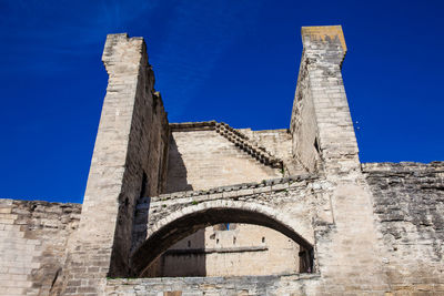 Low angle view of historical building against blue sky