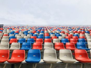 Empty chairs against the sky