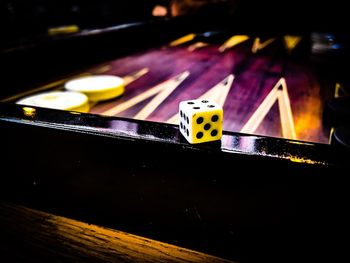 Close-up of illuminated lighting equipment on table