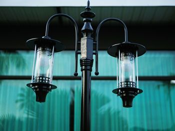 Close-up of water faucet against wall