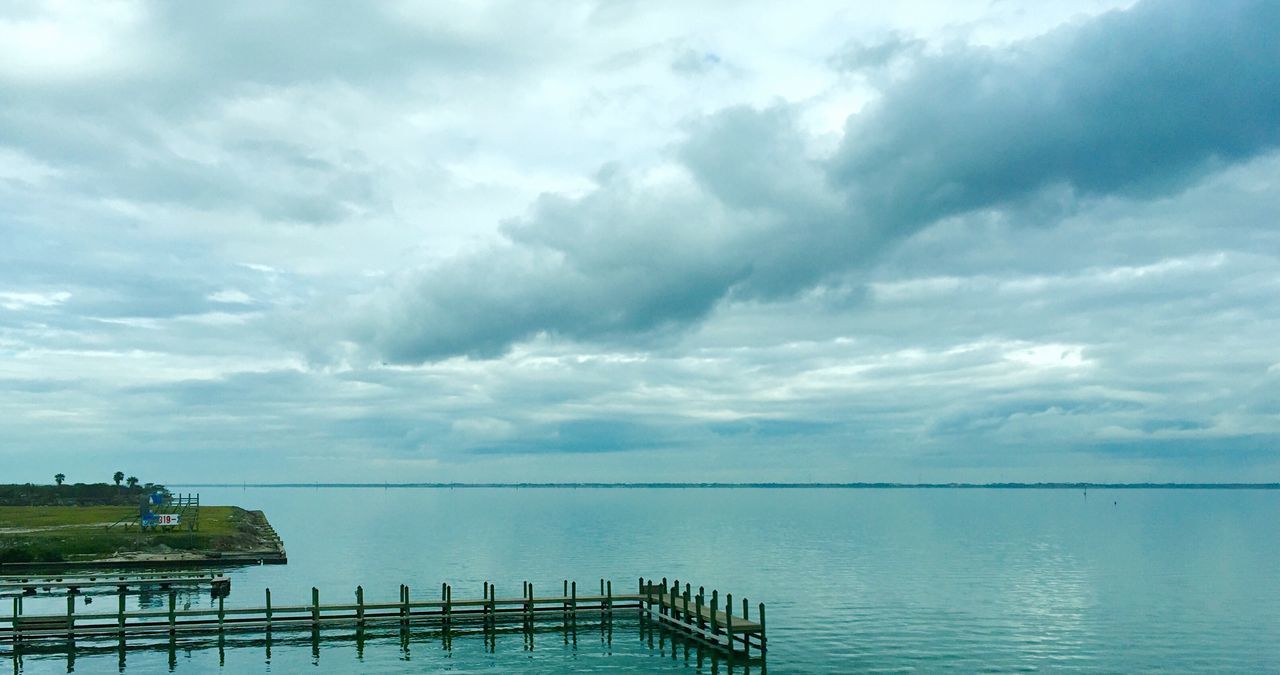 sky, water, sea, tranquility, tranquil scene, cloud - sky, scenics, horizon over water, beauty in nature, cloudy, pier, nature, railing, cloud, idyllic, wood - material, jetty, outdoors, calm, weather