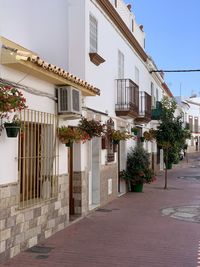 Narrow alley amidst buildings in town