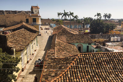 Old houses in town against sky