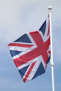Low angle view of flag against sky