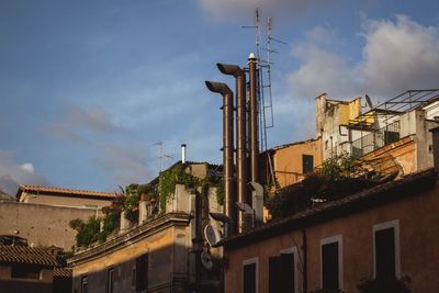 Low angle view of building against cloudy sky