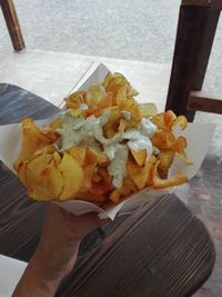 High angle view of person holding food