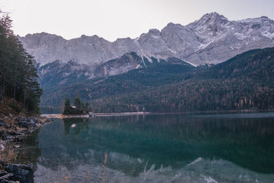 Scenic view of lake and mountains against sky