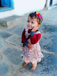 Full length of cute girl standing outdoors