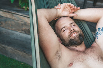 Portrait of young man lying down