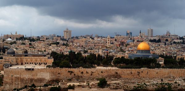 Panoramic view of buildings in city against sky