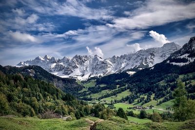 Scenic view of snowcapped mountains against sky