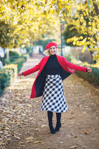 Rear view of woman standing in park