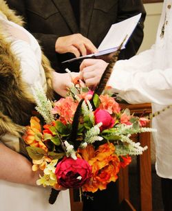 Couple saying their vows, bride's bouquet 