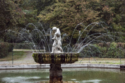 Statue of fountain in lake