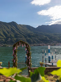 Scenic view of sea and mountains against sky