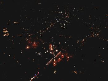 High angle view of illuminated buildings in city at night