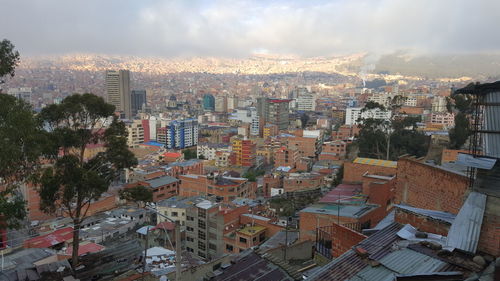 Aerial view of cityscape against sky