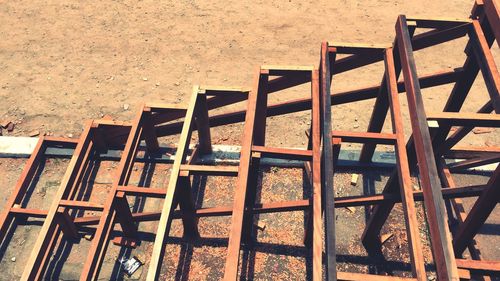 High angle view of chairs and table on field