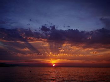 Scenic view of sea against romantic sky at sunset