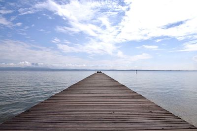 Pier over sea against sky