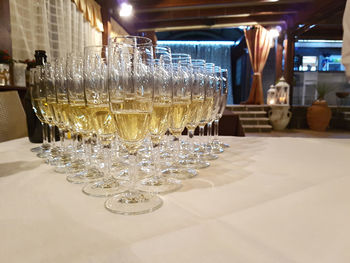 Close-up of wine glasses on table