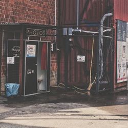 Text at photo booth by building