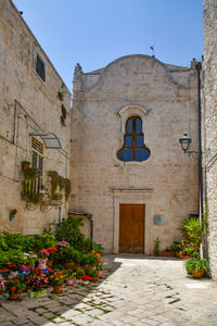 A small street in casamassima, a village with blue-colored houses in the puglia region of italy.