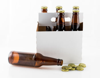 Close-up of bottles against white background