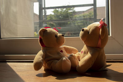 Close-up of stuffed toy on window sill