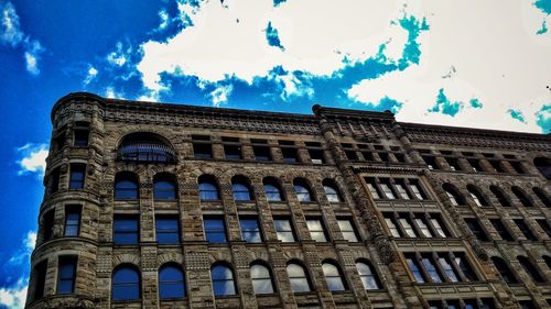 Low angle view of building against blue sky