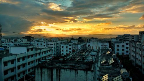 High angle view of buildings against sky during sunset