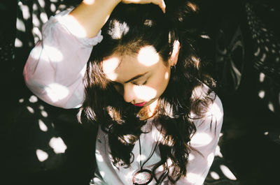 Close-up of young woman with eyes closed