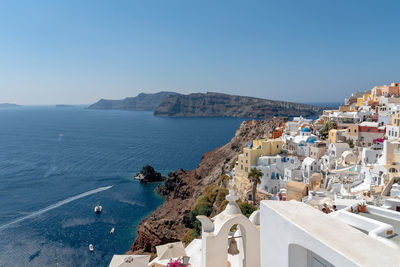 High angle view of buildings against blue sky