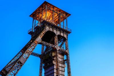 Low angle view of built structure against clear blue sky