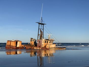 Sailboats on sea against sky