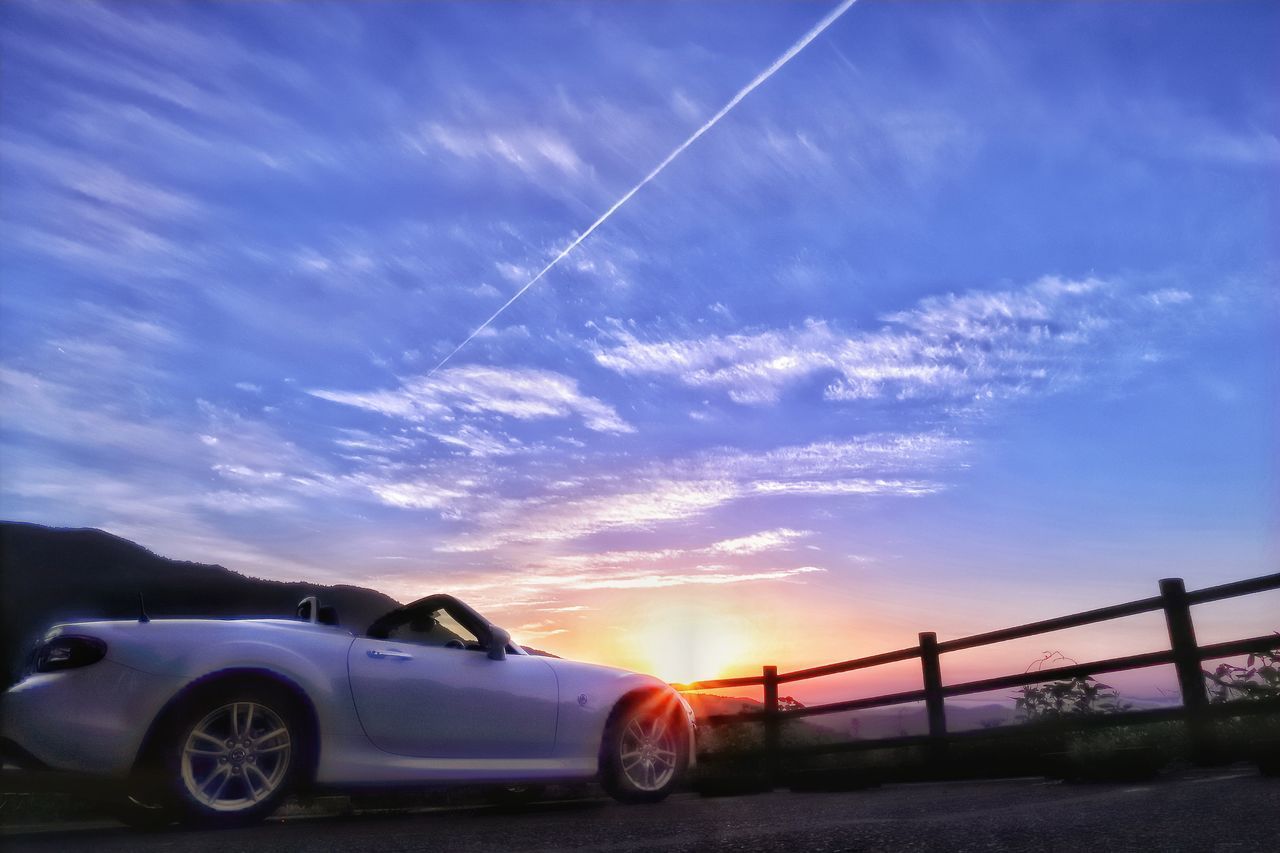 CAR AGAINST SKY DURING SUNSET