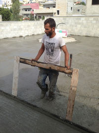 Full length of a man standing in city