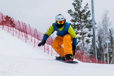 Man skiing on snowy landscape