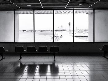 Empty chairs and tables in airport