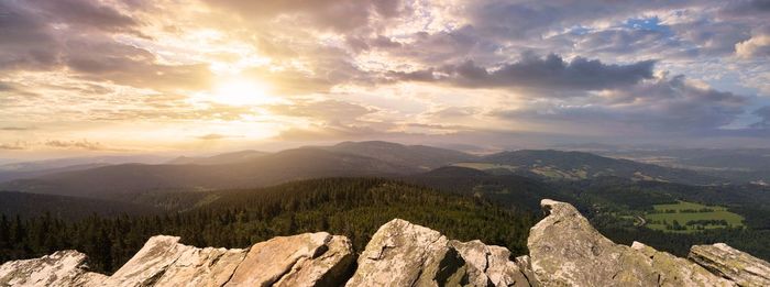 Scenic view of mountains against sky during sunset